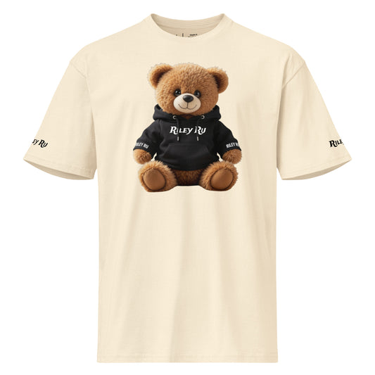 Beige t-shirt with a teddy bear wearing a black hoodie on a white background