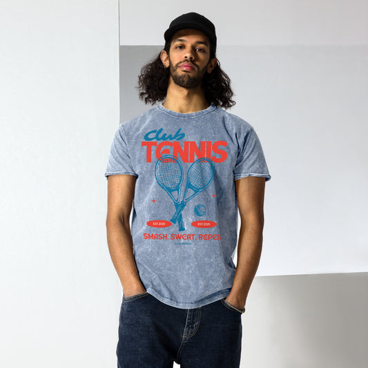 Man wearing a gray t-shirt with tennis-themed design against a plain background