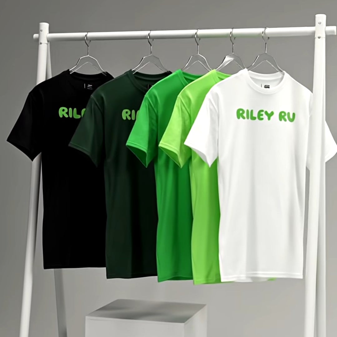 Four t-shirts in black, green, and white on a rack with 'RILEY GU' branding.