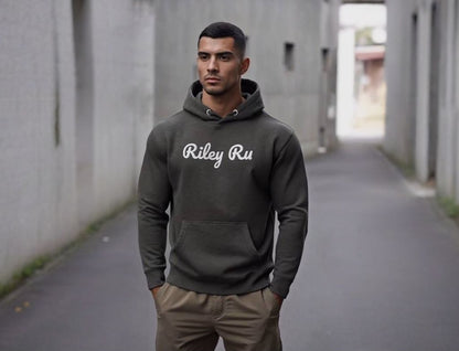 Man wearing a hoodie with 'Riley Ru' logo in an alleyway