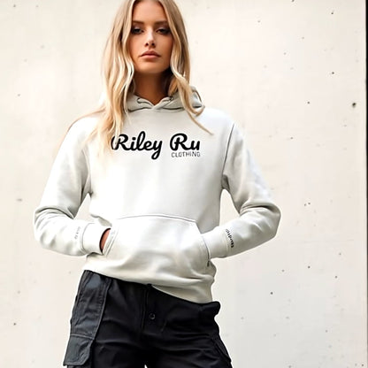Person wearing a white hoodie with 'Riley Ru' branding, black cargo pants, and black boots against a light background.