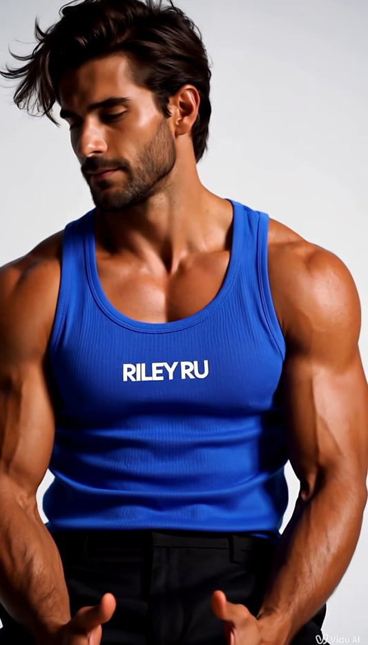 Muscular man wearing a blue tank top with 'RILEY RU' branding against a gray background