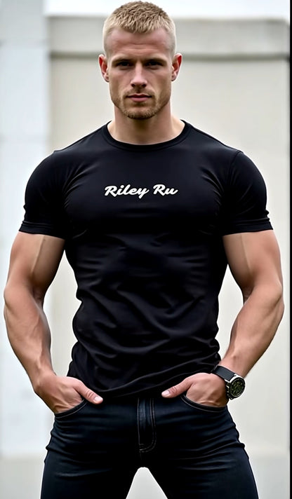 Man wearing a black t-shirt with 'Riley Ru' text, standing against a neutral background