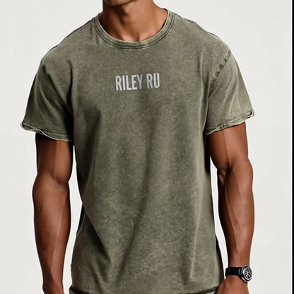 Man wearing a green t-shirt with 'RILEY RU' branding on a white background