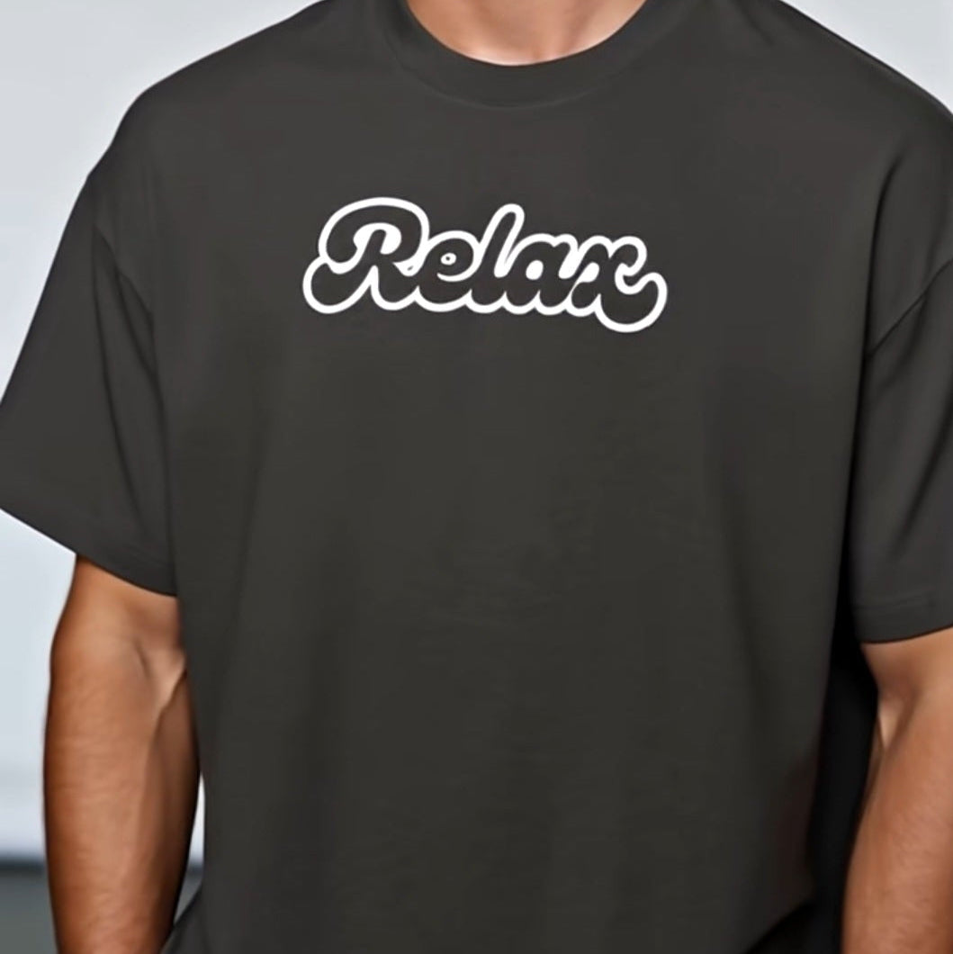 Man wearing a black t-shirt with 'Relax' text on a plain background