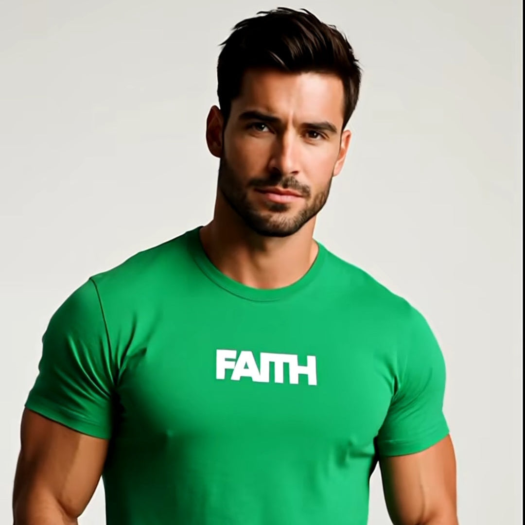 Man wearing a green t-shirt with 'FAITH' printed on it against a plain background