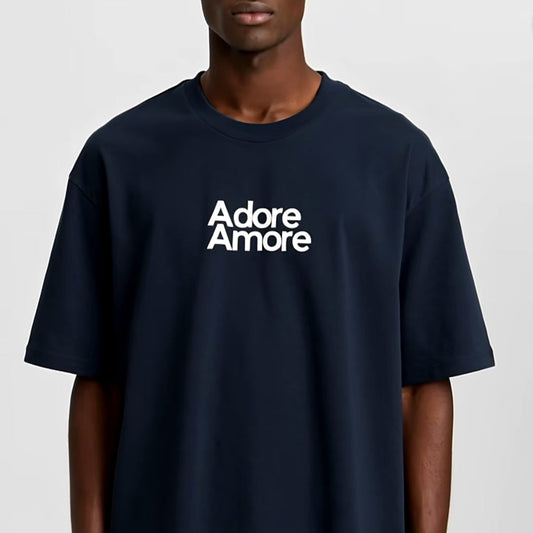 Person wearing a navy blue t-shirt with 'Adore Amore' text on a white background