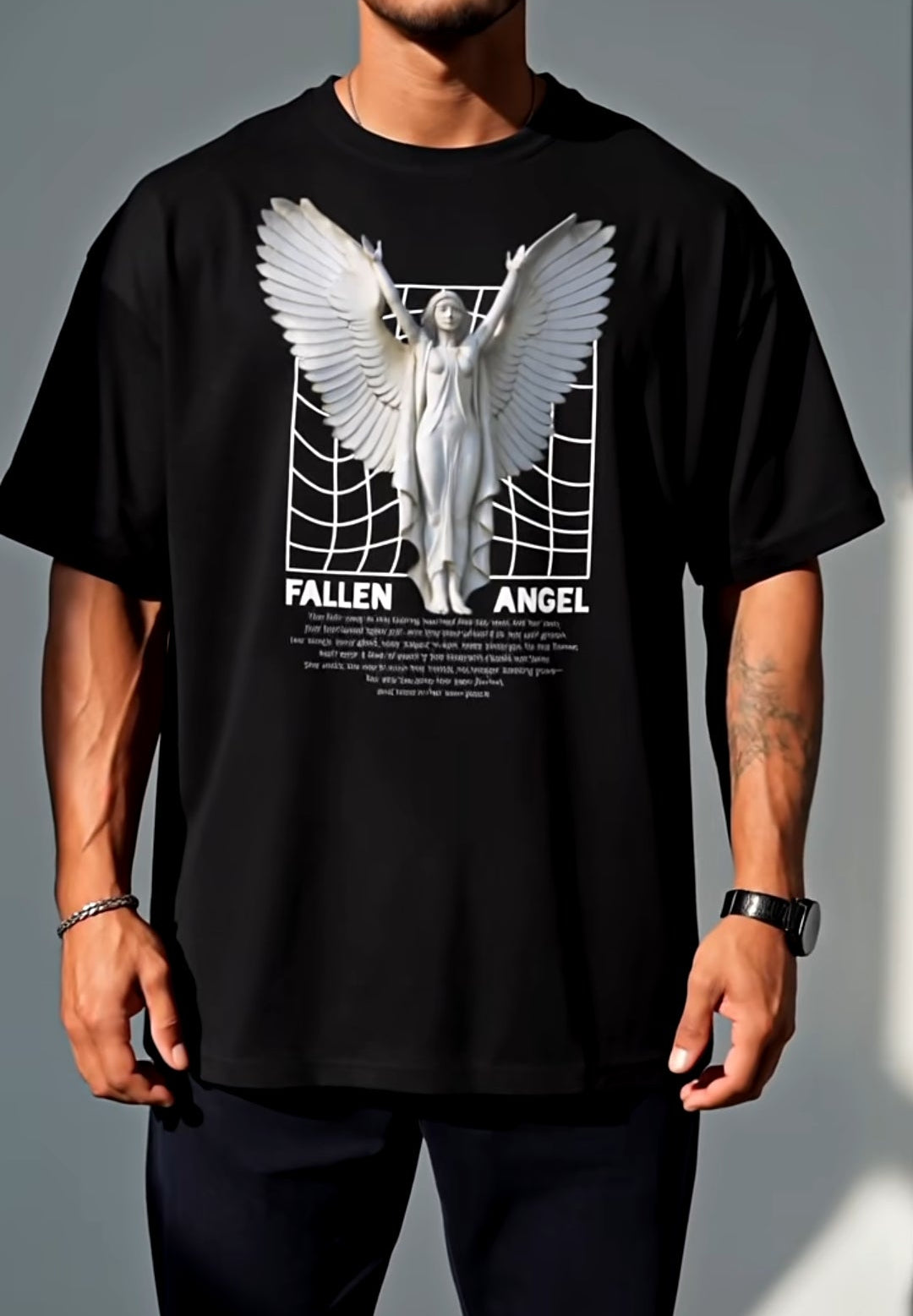 Person wearing a black t-shirt with a 'Fallen Angel' graphic design on a gray background