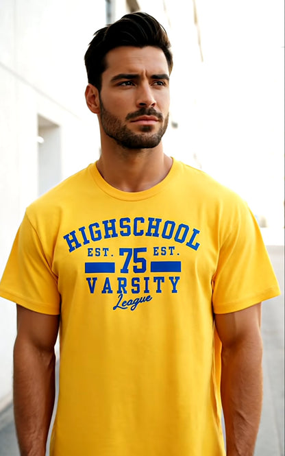 Man wearing a yellow t-shirt with blue text, standing outdoors.