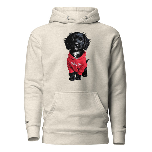Beige hoodie with a black dog in a red outfit on the chest