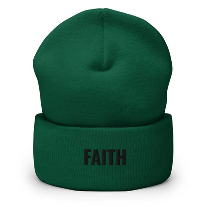 Green beanie with alien head design on a white background