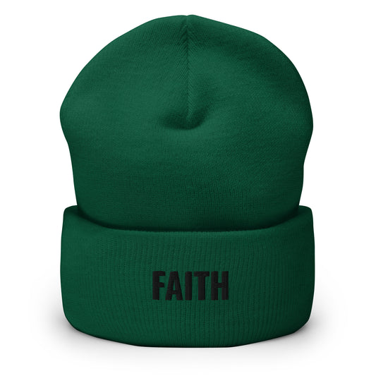 Green beanie with alien head design on a white background