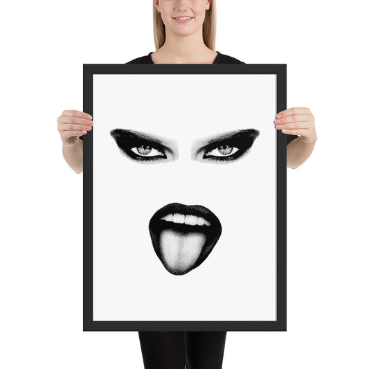 Person holding a framed artwork of a stylized face with black eyes and lips on a white background