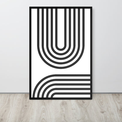 Framed black and white abstract art print on a light gray wall.