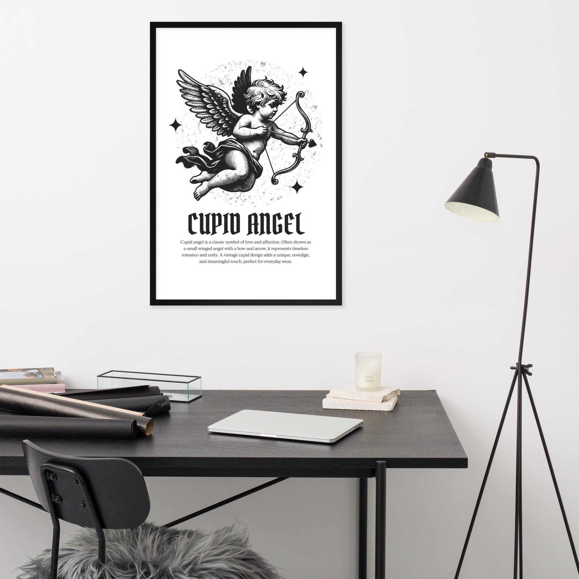 Framed artwork of Cupid Angel on a wall above a desk with office supplies.
