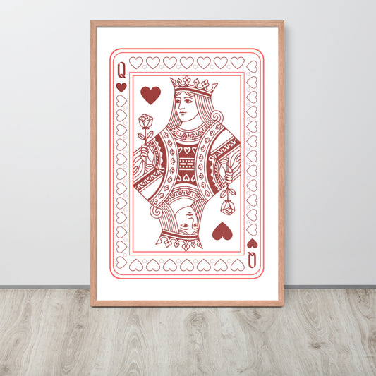 Framed playing card print of a queen with hearts on a white wall.