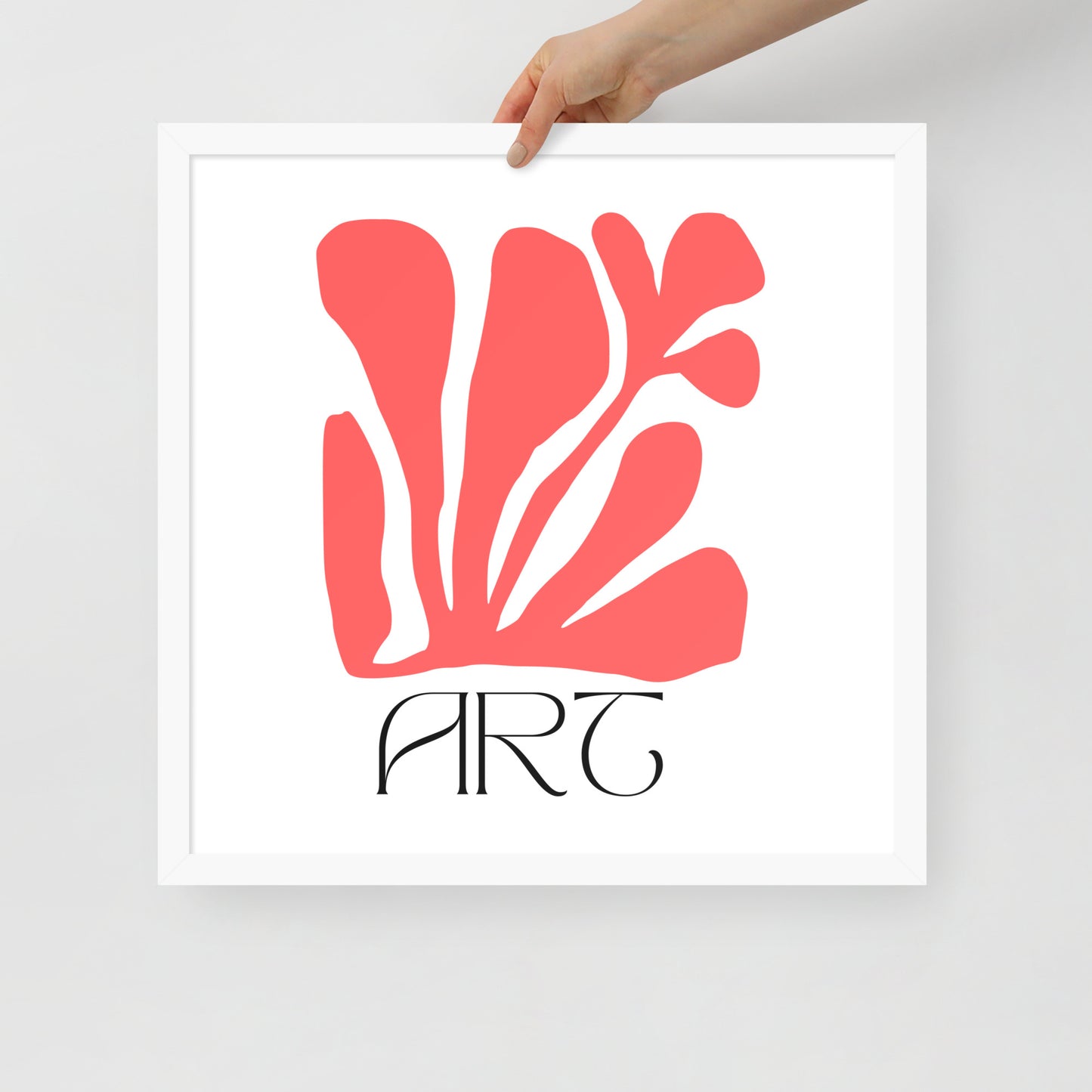 Framed artwork with red abstract design and 'ART' text on a white background