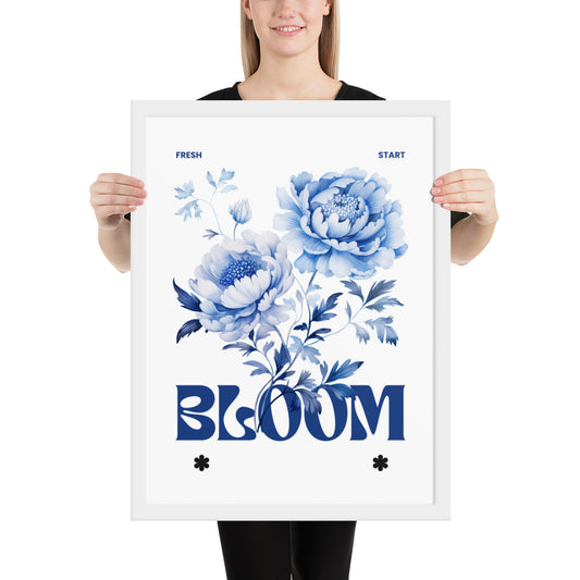 Person holding a framed poster with blue floral design and 'BLOOM' text.