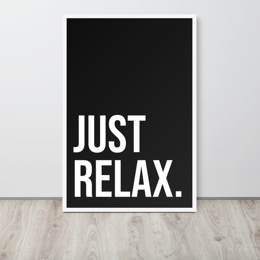 Black poster with 'JUST RELAX.' text on a white wall.