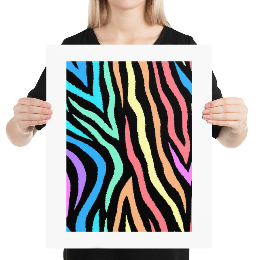 Person holding a framed colorful zebra pattern against a white background