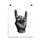 Black and white illustration of a hand making a rock-on gesture on a white background