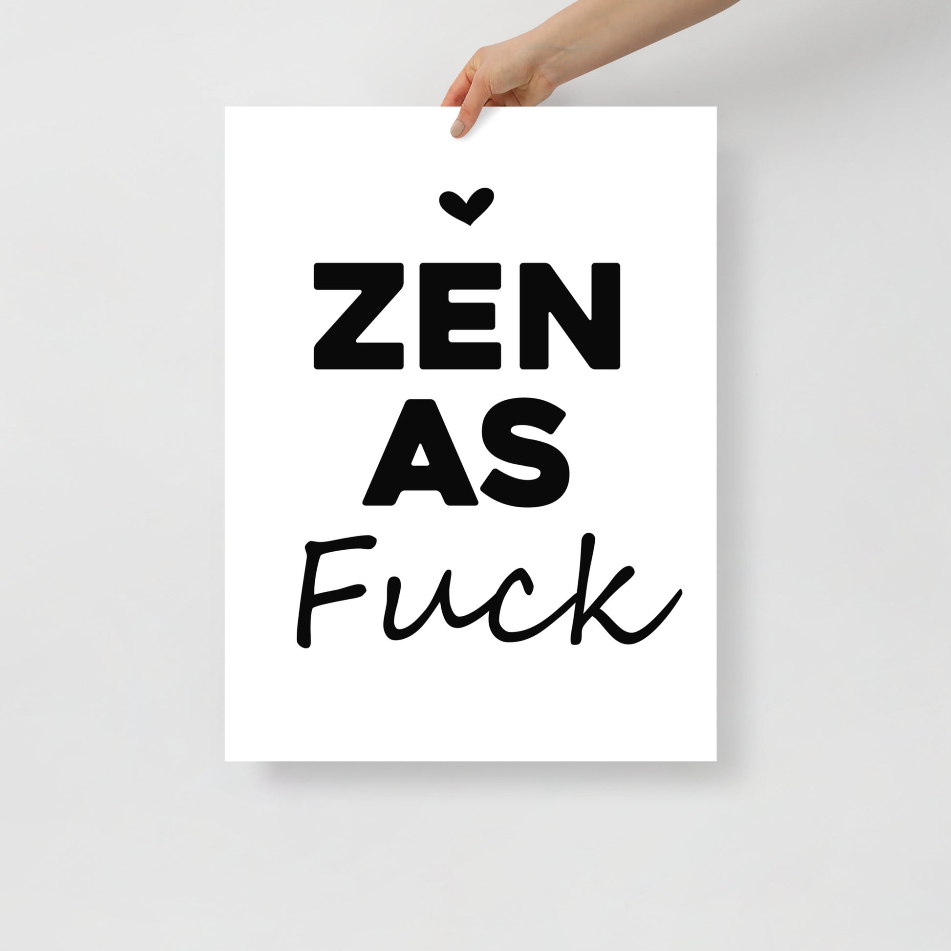 Poster with 'ZEN AS FUCK' text held by a hand on a light gray background