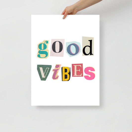 Poster with 'good vibes' text in colorful letters held by a hand on a light gray background