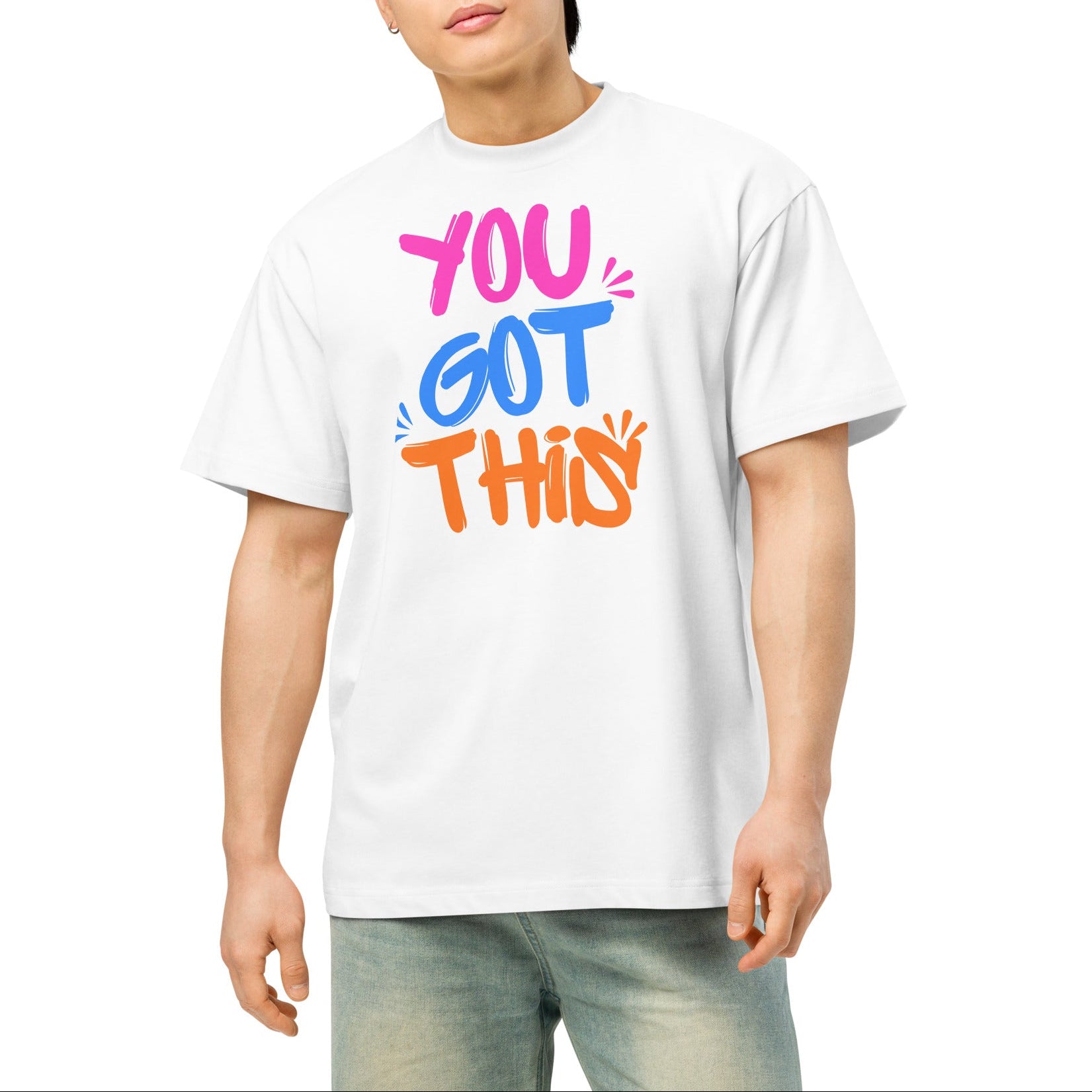 Person wearing a white t-shirt with colorful text on a white background
