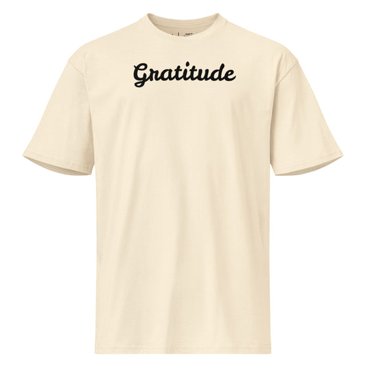 Beige t-shirt with 'Gratitude' text on a white background