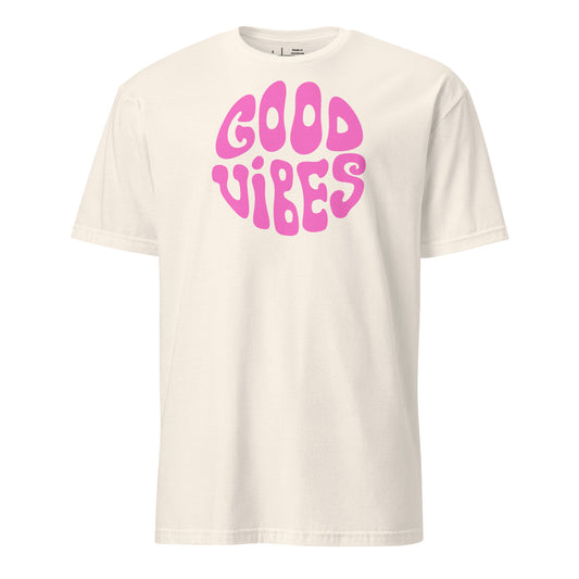 White t-shirt with pink 'Good Vibes' text on a white background