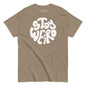 Brown t-shirt with 'Stay Weird' text in white on a white background