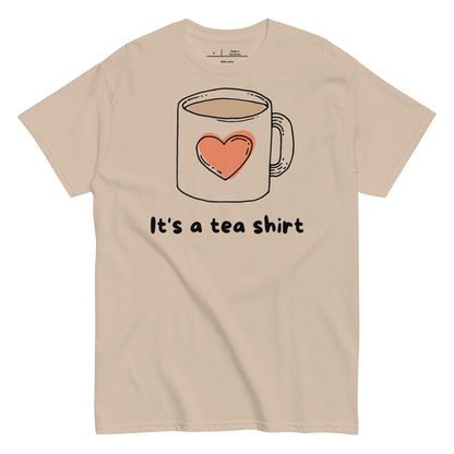 Beige t-shirt with a graphic of a coffee mug with a heart and text 'It's a tea shirt' on a white background