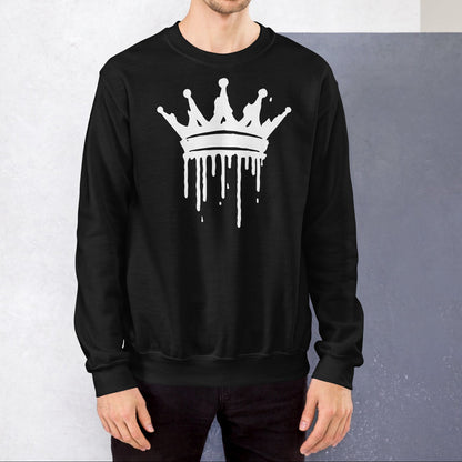 Man wearing a black sweatshirt with a white crown design against a gray background
