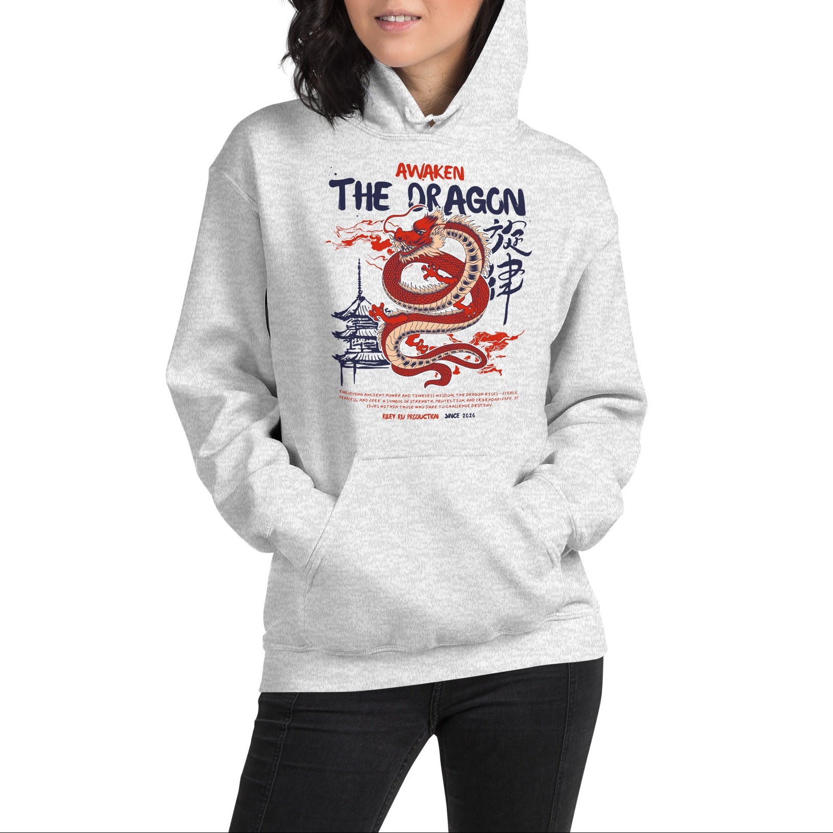 Person wearing a gray hoodie with a dragon design and text on a white background