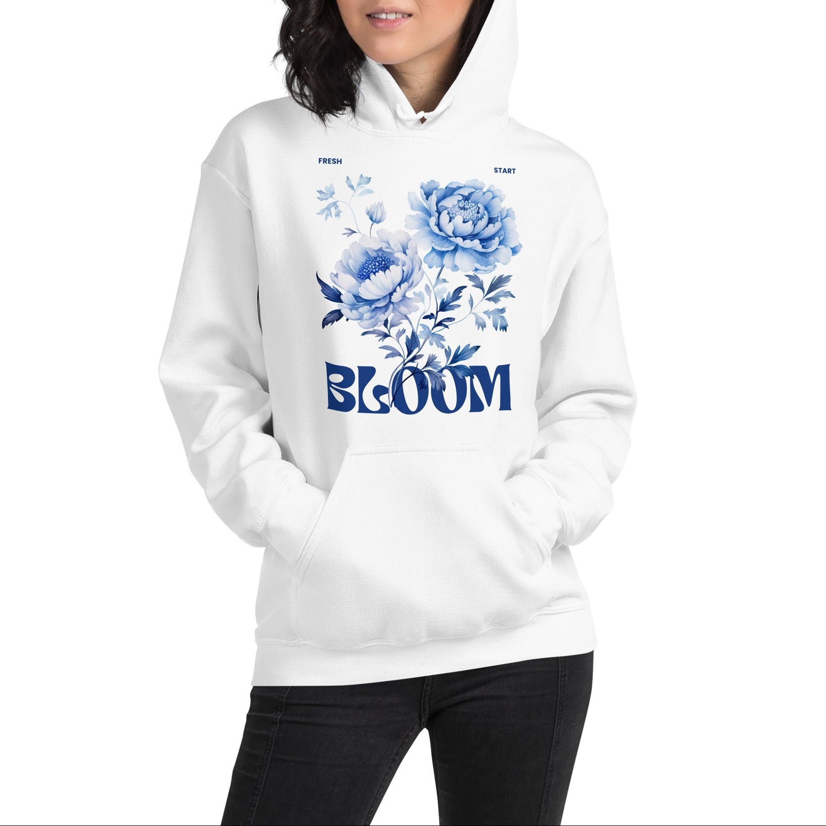 Person wearing a white hoodie with blue floral design and 'BLOOM' text on a white background