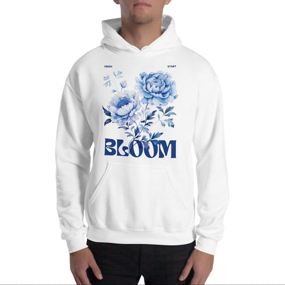 Person wearing a white hoodie with blue floral design and 'BLOOM' text on a white background