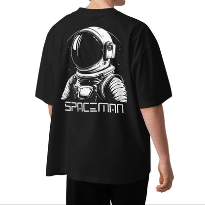 Person wearing a black t-shirt with an astronaut graphic and 'SPACEMAN' text on the back.