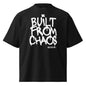 Black t-shirt with 'Built from Chaos' text on a white background