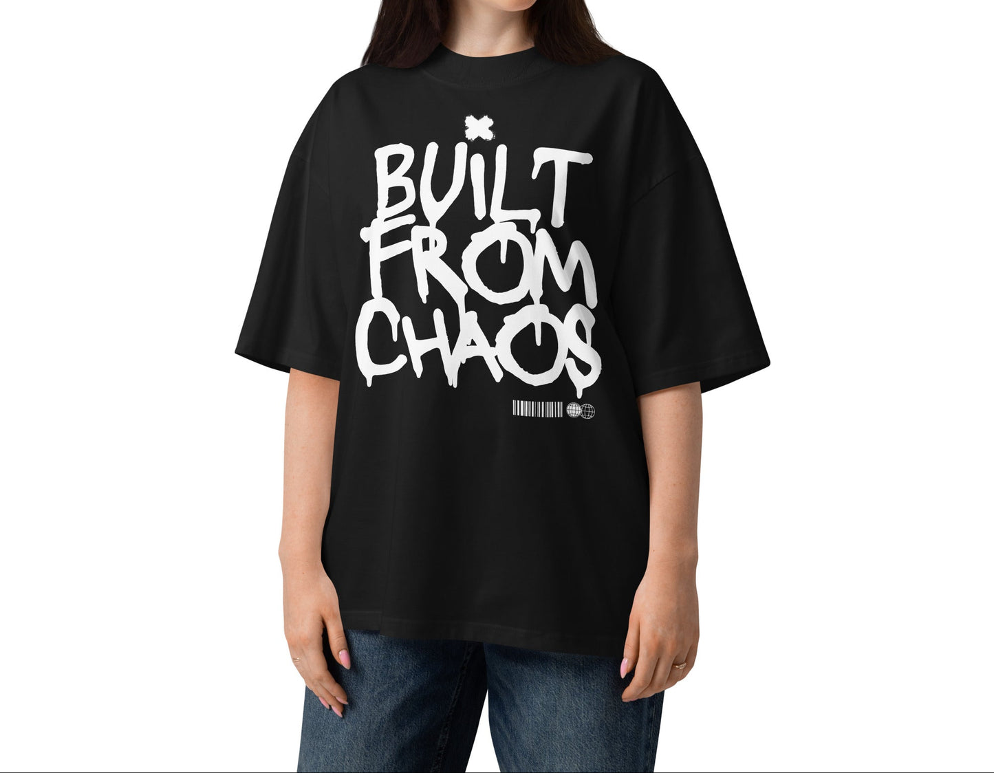Person wearing a black t-shirt with 'Built from Chaos' text on a white background