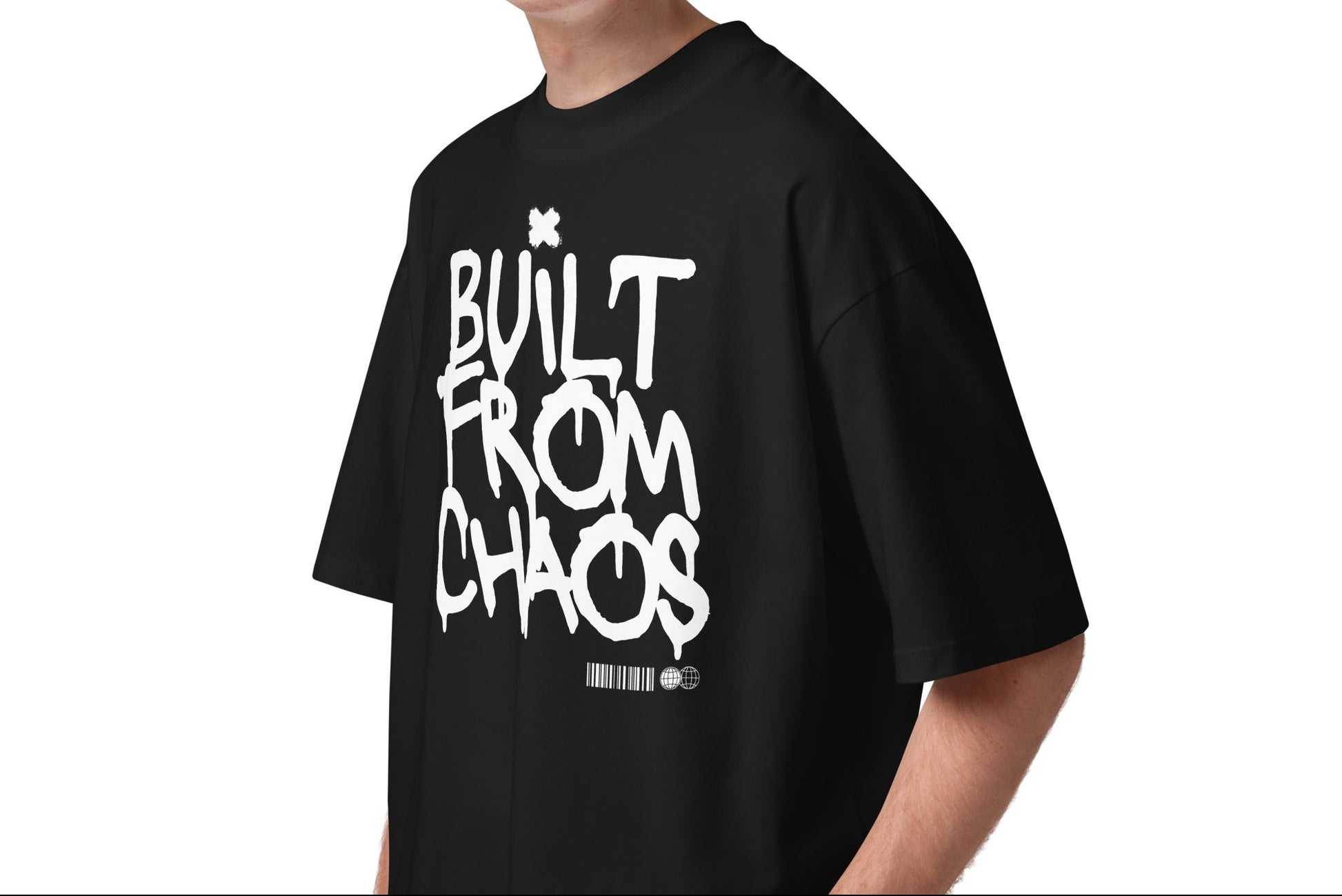 Person wearing a black t-shirt with 'Built from Chaos' text on a white background