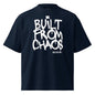 Navy blue t-shirt with 'Built from Chaos' text on a white background
