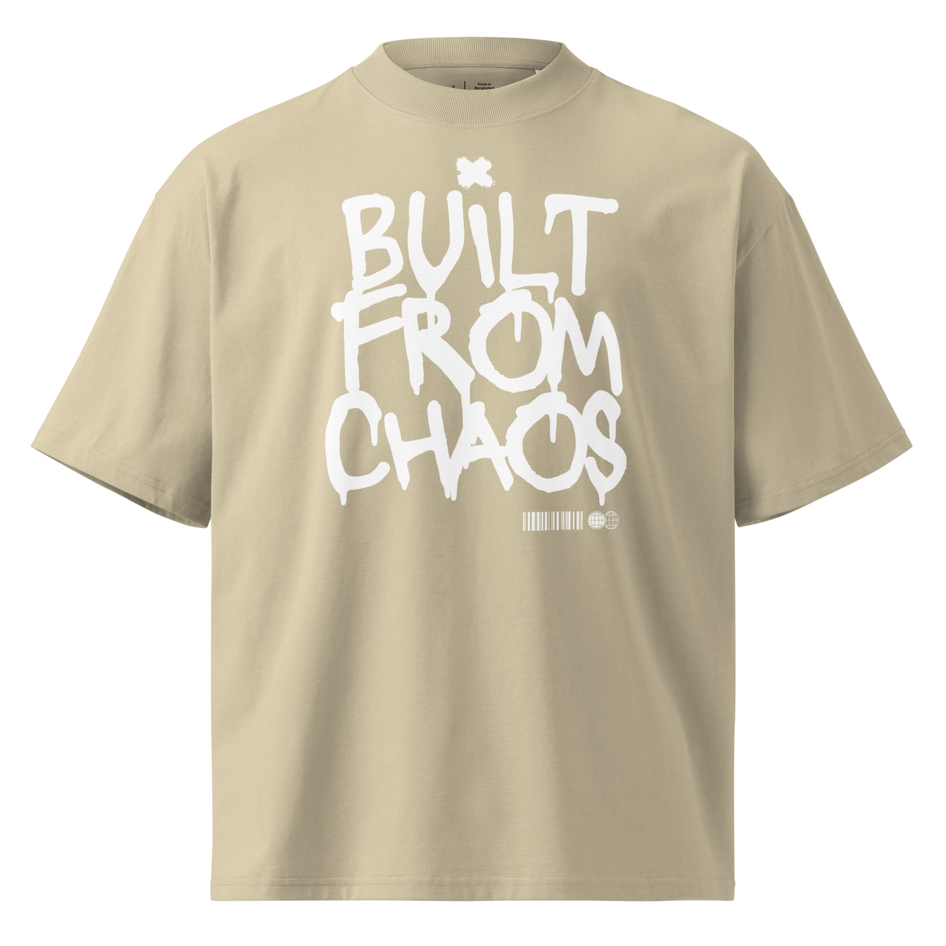 Beige t-shirt with 'Built from Chaos' text on a white background