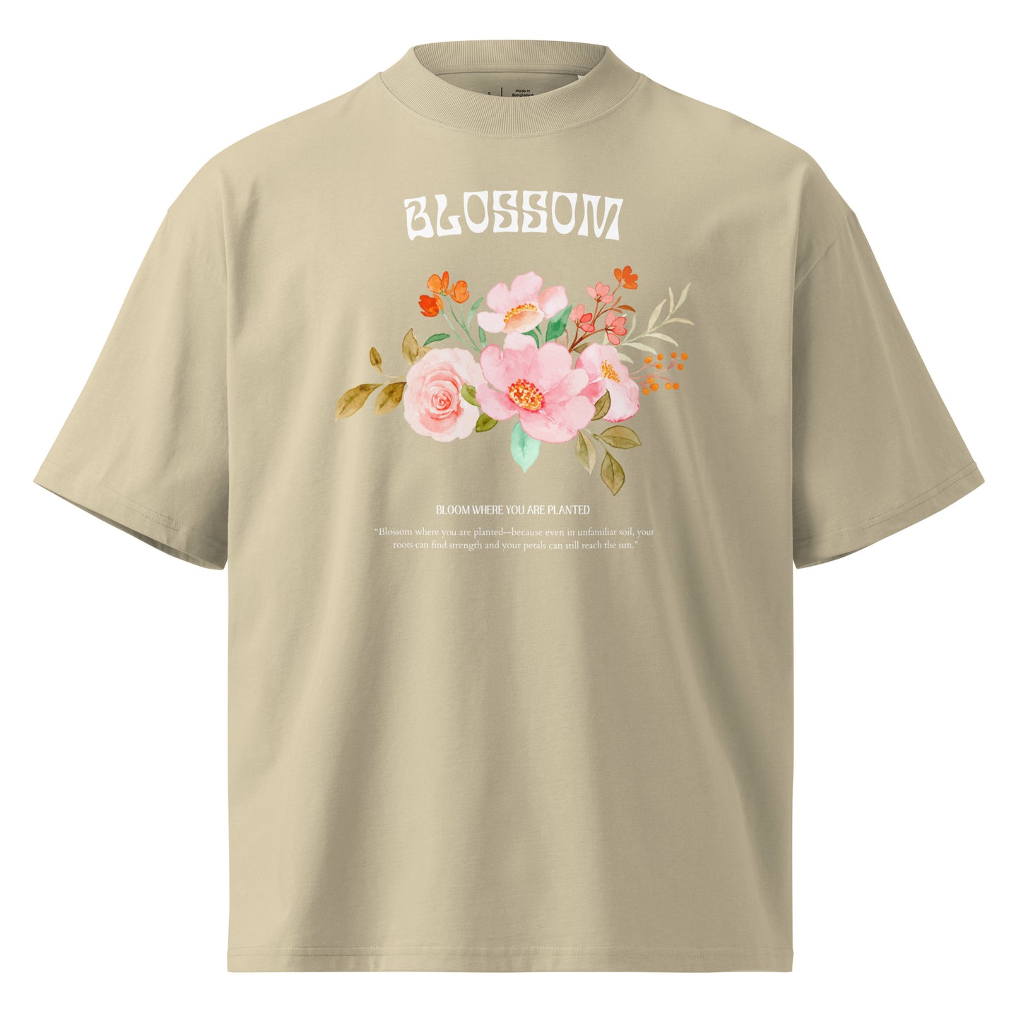 Beige t-shirt with floral design and 'Blossom' text on a white background
