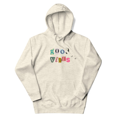 Beige hoodie with 'good vibes' text on a white background