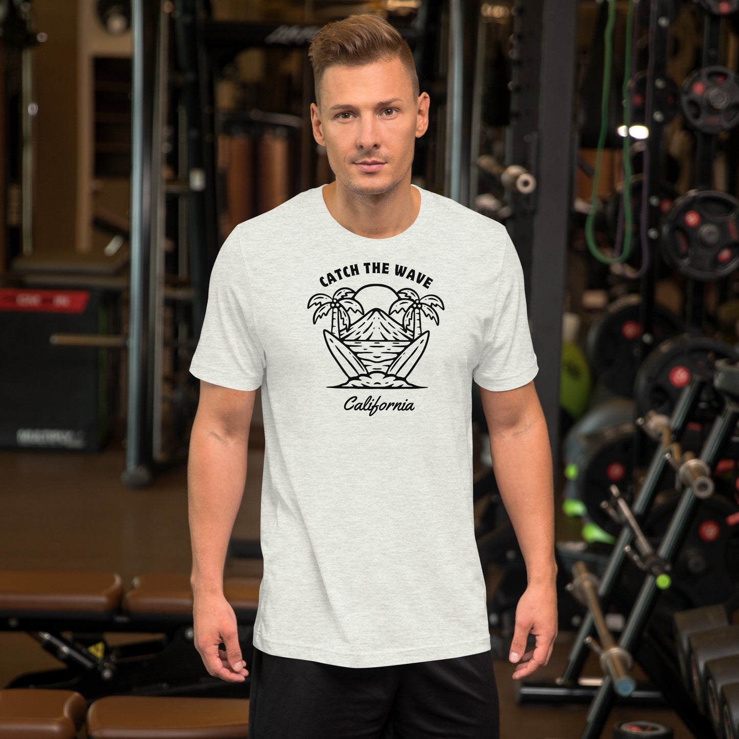 Man wearing a white t-shirt with a graphic design in a gym setting