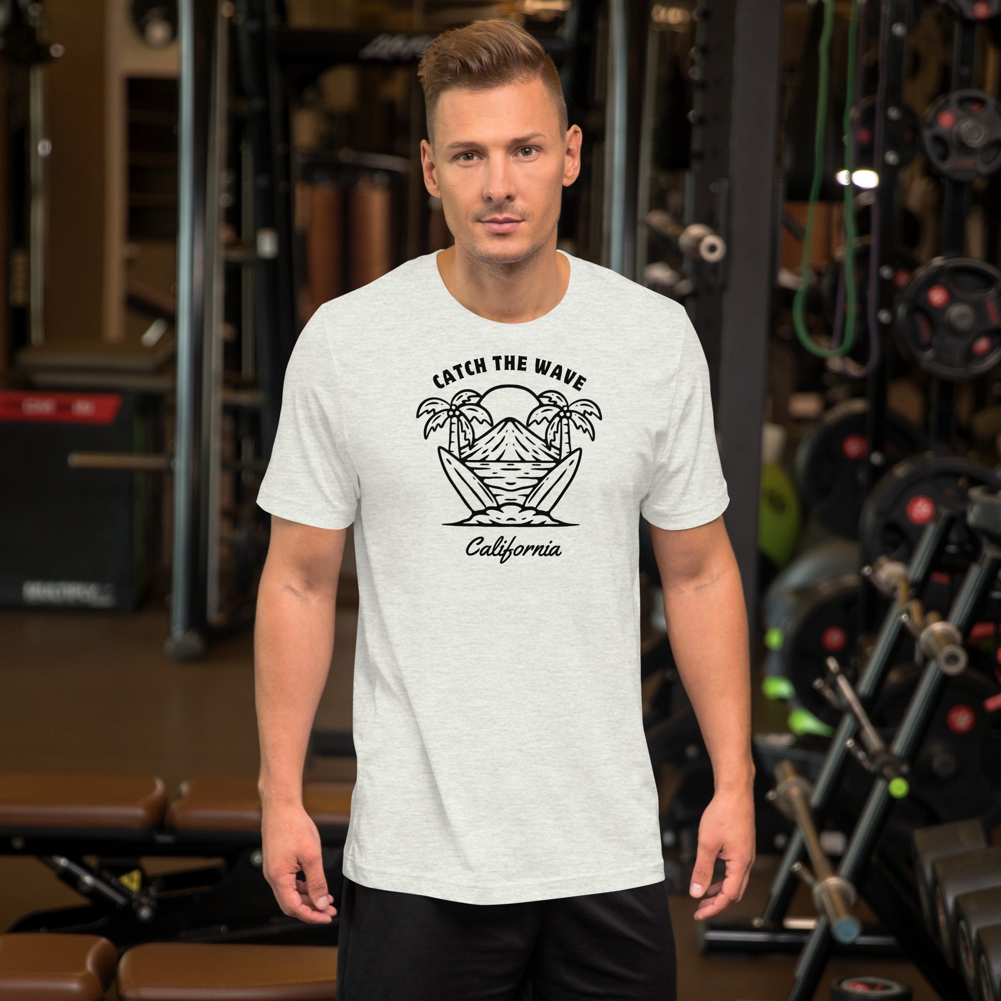 Man wearing a white t-shirt with a graphic design in a gym setting