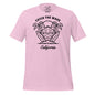 Pink t-shirt with a beach graphic and 'Catch the Wave California' text on a white background