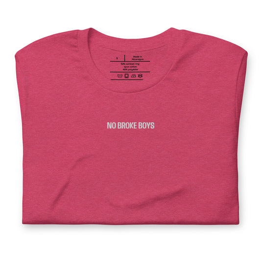 Folded pink t-shirt with 'NO BROKE BOYS' text on a white background