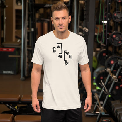 Man wearing a white t-shirt with black abstract design in a gym setting