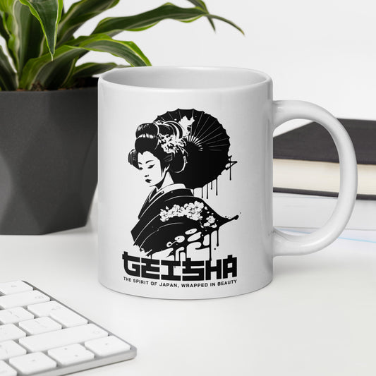 White mug with a black and white design of a geisha and text on a desk with a plant and books in the background.